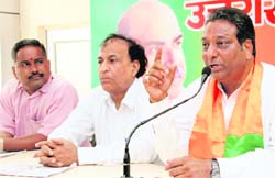 BJP mayoral candidate Vinod Chamoli addresses a press conference in Dehradun on Friday. Tribune photo: Vinod Pundir