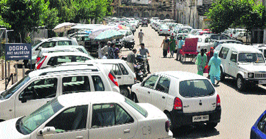 Haphazardly parked vehicles on the premises of historic Mubarak Mandi Complex cause a lot of inconvenience to commuters.