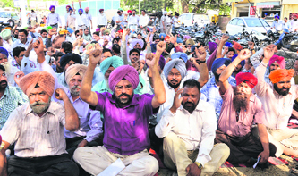 Members of the Government Schoolteachers Union, Punjab, hold a protest rally in Ludhiana on Friday.