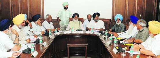 Punjab Chief Minister Parkash Singh Badal along with Deputy Chief Minister Sukhbir Badal at a Cabinet meeting in Chandigarh on Friday. A Tribune photograph