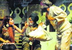 Artistes enact a scene from the play Daughter of the Bin at Punjab Natshala in Amritsar on Saturday.