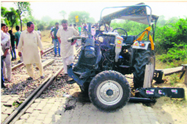The mangled remains of the tractor after it collided with a train at an unmanned railway crossing near Behman Diwana village in Bathinda district on Saturday.