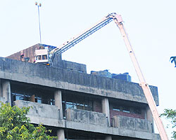 Firefighters try to enter the Punjab Mini-Secretariat building where a fire broke out on March 17