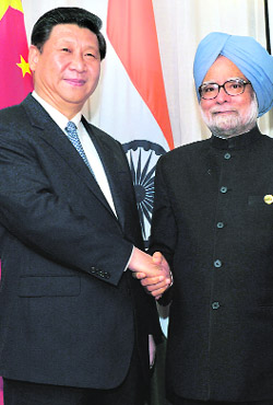 Dr Manmohan Singh with Chinas President Xi Jinping at BRICS Summit in Durban. 
