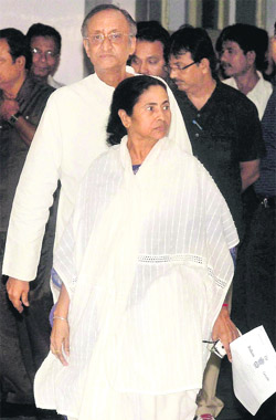 CM Mamata Banerjee and Finance Minister Amit Mitra arrive to address the chit fund issue and announce the gazette notification in Kolkata. 