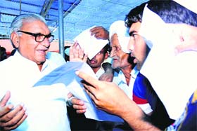 Chief Minister Bhupinder Singh Hooda hears the grievance of people at Canal Rest House in Rohtak on Sunday