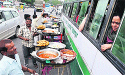 Vendors selling eatables to passengers at Lakhanpur, the entrance point to Jammu and Kashmir, on Saturday