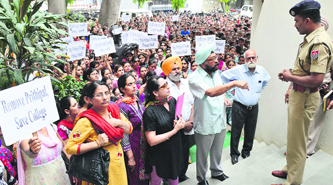 Students, members of the management and staff of Guru Nanak Girls College, Model Town, outside the office of the Commissioner of Police, Ishwar Singh, in Ludhiana on Saturday. 