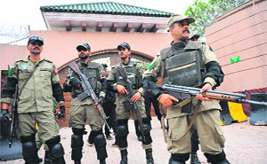 Paramilitary personnel stand guard outside Pervez Musharrafs residence in Islamabad. 
