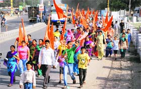 Unfazed by the rising temperature, devotees march on foot to the Hanuman temple in Goniana from Bathinda on Sunday