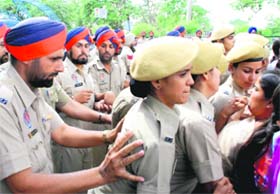 Policemen using lady constables as a shield to counter the protesting female members of the Special Trainer Teachers Union in Bathinda on Sunday