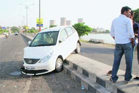 The car that rammed into the divider after colliding with another vehicle near lake number 3 in Bathinda on Sunday