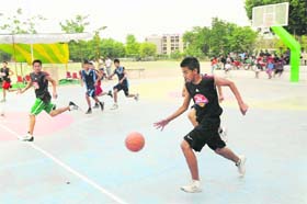 Players of Bathinda and Moga in action during the sub-junior basketball tournament at the Police Public School ground in Bathinda