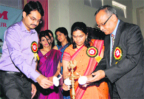 Deputy Commissioner Ashish Singhmar and SIHM Principal PK Gupta light a lamp to inaugurate the annual function in Hamirpur on Saturday.