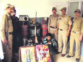 The accused in police custody with the stolen goods in Batote on Sunday