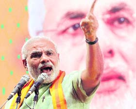 Gujarat Chief Minister Narendra Modi addresses a rally in Bangalore on Sunday