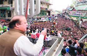 Former Premier Nawaz Sharif addresses supporters during a general election campaign meeting in Murree on Sunday