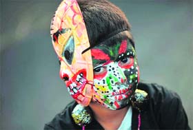 Colour of joy: A boy attends the Joy for Life Carnival in Managua on Saturday