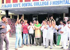 Family members of the deceased protest outside the Govt Dental College in Amritsar on Monday