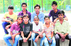 Slum children who are working as the ball boys in the ongoing ITF Mens Futures Tennis Tournament in Chandigarh on Monday.