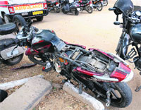 The damaged motorcycle on which the youths were triple riding.