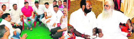 BJP mayoral candidate from Haridwar Manoj Garg takes feedback from party workers at the Vivek Vihar election office; and (right) Congress mayoral candidate Swami Rishishwaranand interacts with a spiritual guru in Haridwar on Monday.