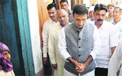Randeep Singh Surjewala, PWD and Industries Minister, visits members of the Dalit community in Pabnawa village of Kaithal. Photo: Satish Seth