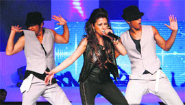 Party time: Pop singer Hard Kaur performs during a function in Gurgaon.