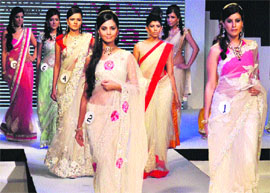 Models walk the ramp during a fashion show in Gurgaon.