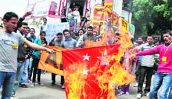 ABVP activists burn a Chinese flag in protest against Chinese intrusion into Indian territory, in Shimla on Monday. Photo: Amit Kanwar