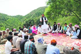 A PDP leader addresses a meeting under mass contact programme at Shahdra Sharief on Sunday