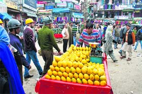 A vendor sells mangoes in Srinagar on Monday