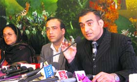 Medical Employees Joint Action Forum chairman Nisar-ul-Hassan addresses a press conference in Srinagar on Monday