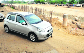 A car passes through the narrow stretch along Sidhwan Canal in Ludhiana.