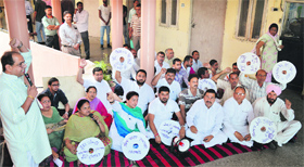 Congress councillors stage a protest at the MC office in Ludhiana on Monday.