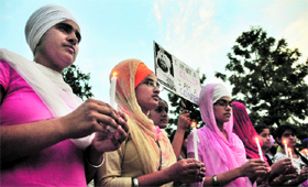 Students of Punjab Agricultural University take out a candlelit march in Ludhiana on Monday.