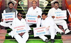 Five Congress MPs from Telangana launched a 48-hour sit-in at the main gate of Parliament on Monday