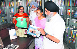 Punjabi University VC Dr Jaspal Singh reads a book in the IK Gujral Corner at the campus library in Patiala on Monday. 