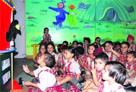 Students enjoy a puppet show at Shemrock School in Mohali