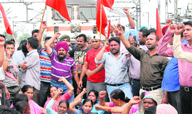 NRMU members stop the Mumbai-bound Paschim Express near the Jalandhar city railway station in support of their demands on Tuesday.
