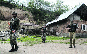 Army and police personnel conduct a search in the Sopore area of north Kashmir on Saturday. 