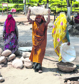 Its life as usual for these labourers on the eve of May Day at Gandhi Nagar in Jammu on Tuesday.