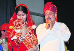 Artistes enact a scene from play Doli Government Women College Gandhi Nagar in Jammu on Tuesday.
