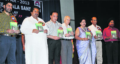  Minister of Housing, Horticulture, and Culture Raman Bhalla releases a book Sangeet Savita during a function in Jammu on Tuesday.
