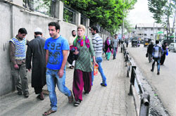 Pedestrians walk freely near the Lal Chowk in Srinagar on Tuesday after the area was cleared of encroachments by the Srinagar Municipal Corporation.