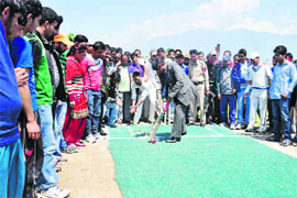 Vice- Chancellor Prof Talat Ahmad bats during the inaugural function of the 2nd VCs T-20 cricket tournament in Srinagar on Tuesday. 