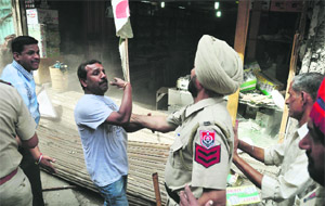 A protester argues with a policeman.