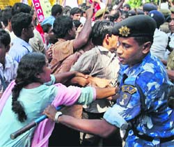 SUCI activists tussle with RAF personnel and policemen during their agitation in front of West Bengal Assembly in Kolkata on Tuesday.  PTI