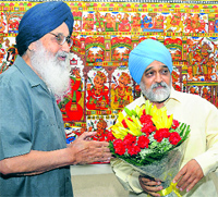 Chief Minister Parkash Singh Badal greets Montek Singh Ahluwalia, Deputy Chairman, Planning Commission in New Delhi on Tuesday.
