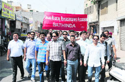 Members of the Punjab Medical Representatives Association hold a rally in Bathinda on Wednesday.